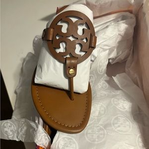 Tory Burch sandals, size 8. They run small, I’m a size 7.